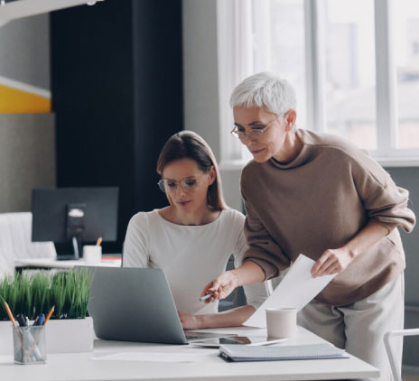 two-confident-businesswomen-looking-at-computer-mo-2023-11-27-05-19-06-utc.jpg