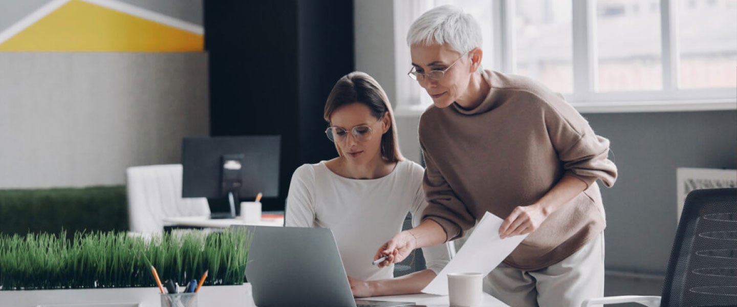 two-confident-businesswomen-looking-at-computer-mo-2023-11-27-05-19-06-utc.jpg